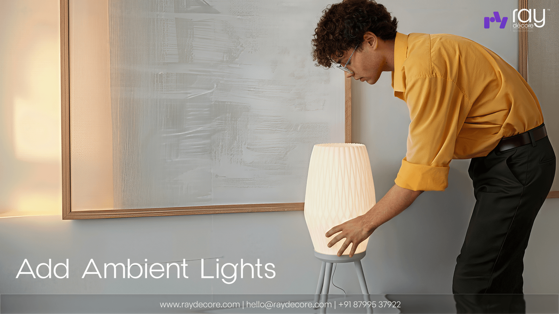 a man decorating a living room with Ray Decore's Gleam Lamp